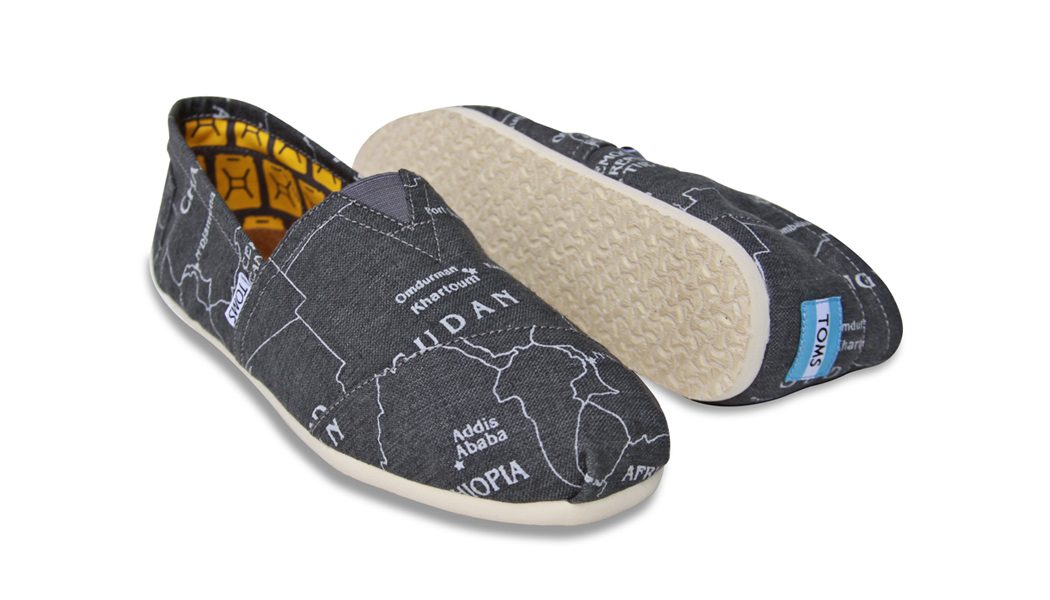 Pair of TOMS shoes with a gray map print of Ethiopia and Sudan, shown with the sole