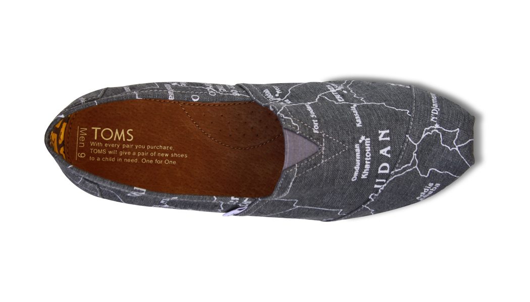 Gray TOMS shoe with a map print, seen from above with the insole message