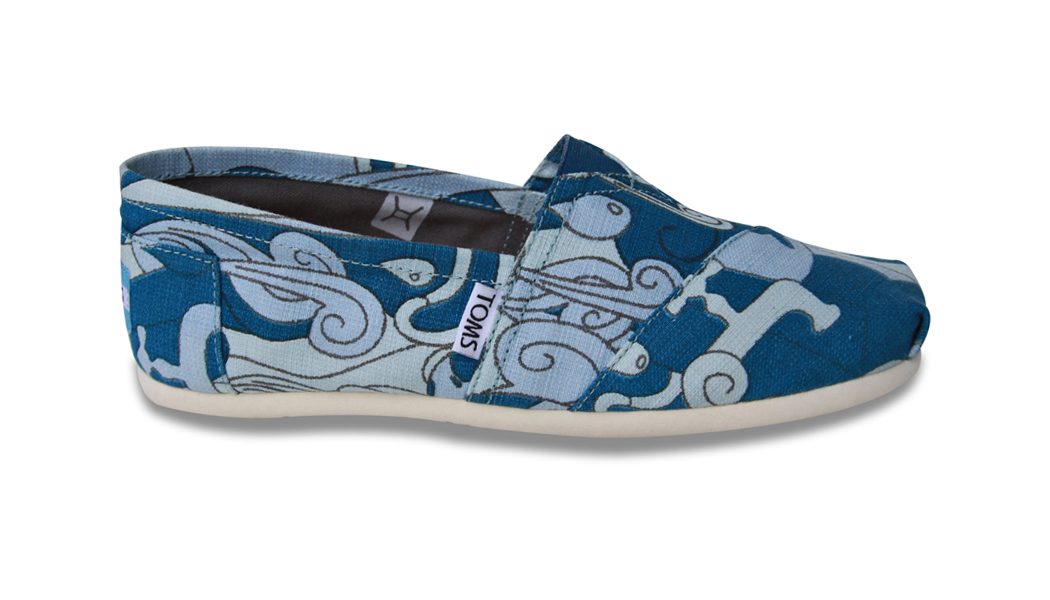 Blue wave-pattern TOMS shoe in side view