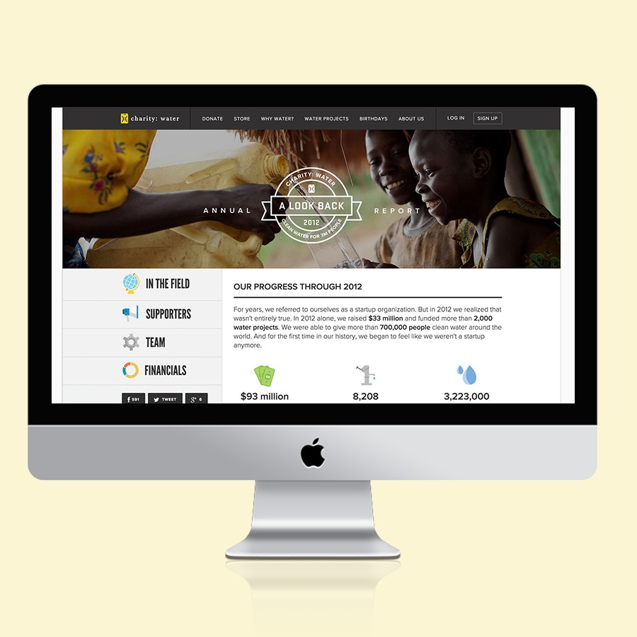 charity: water annual report shown on a desktop display